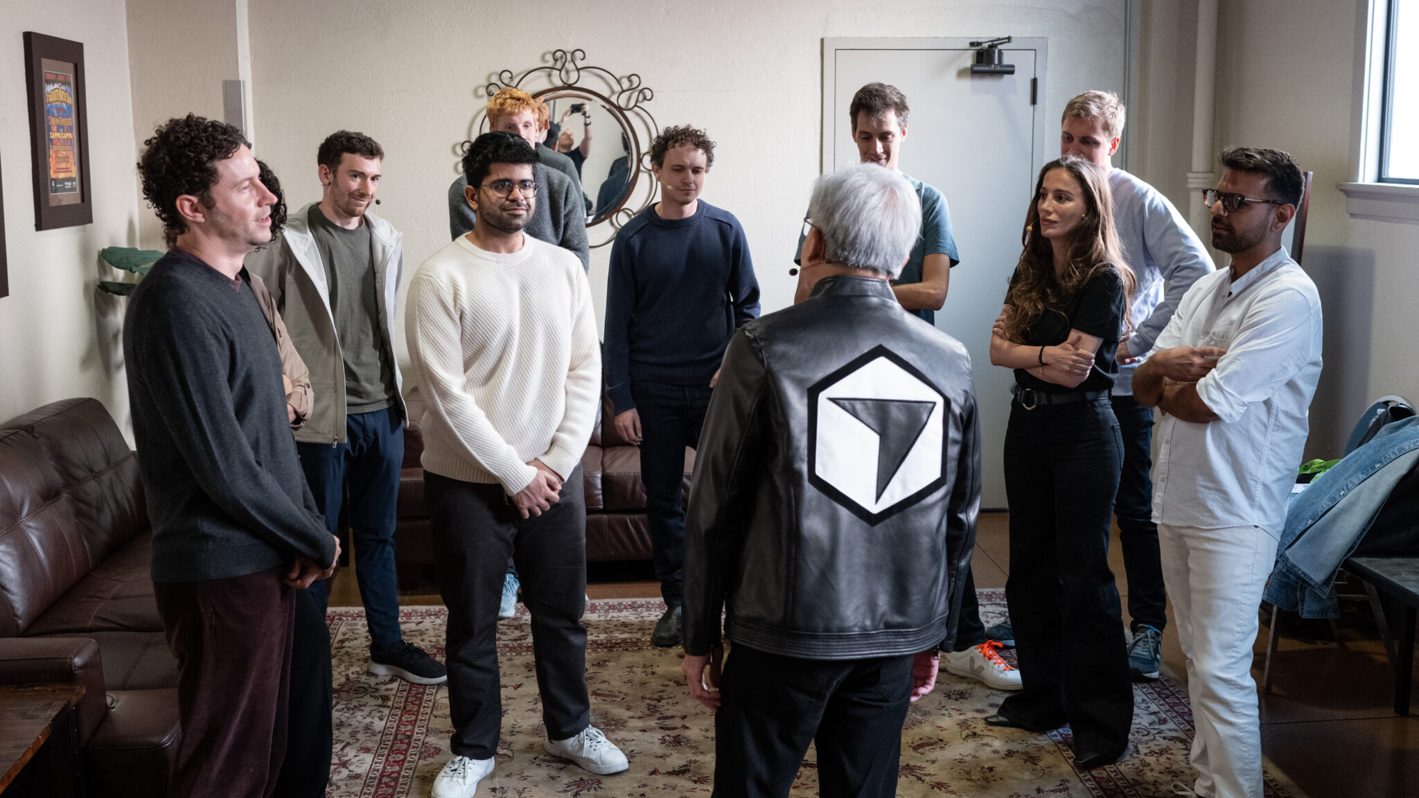 NVIDIA CEO Jensen Huang, sporting a custom leather jacket from Cursor, meets with open model 생태계 leaders before a panel discussion at GTC.